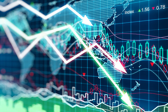 A digital graph displays fluctuating stock prices, featuring green and red candlestick bars, arrows indicating upward and downward trends, and a world map in the background. Data points include an index value of 1.56 and a decrease of 0.78, signifying market movements.