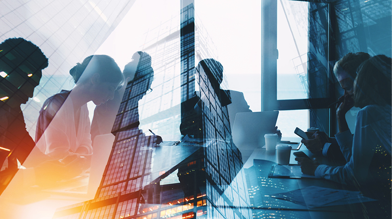 A modern office scene shows silhouettes of people engaged in discussion and collaboration around a table. Overlaid images of skyscrapers and cityscapes reflect a dynamic business environment, suggesting innovation and teamwork in a corporate setting.