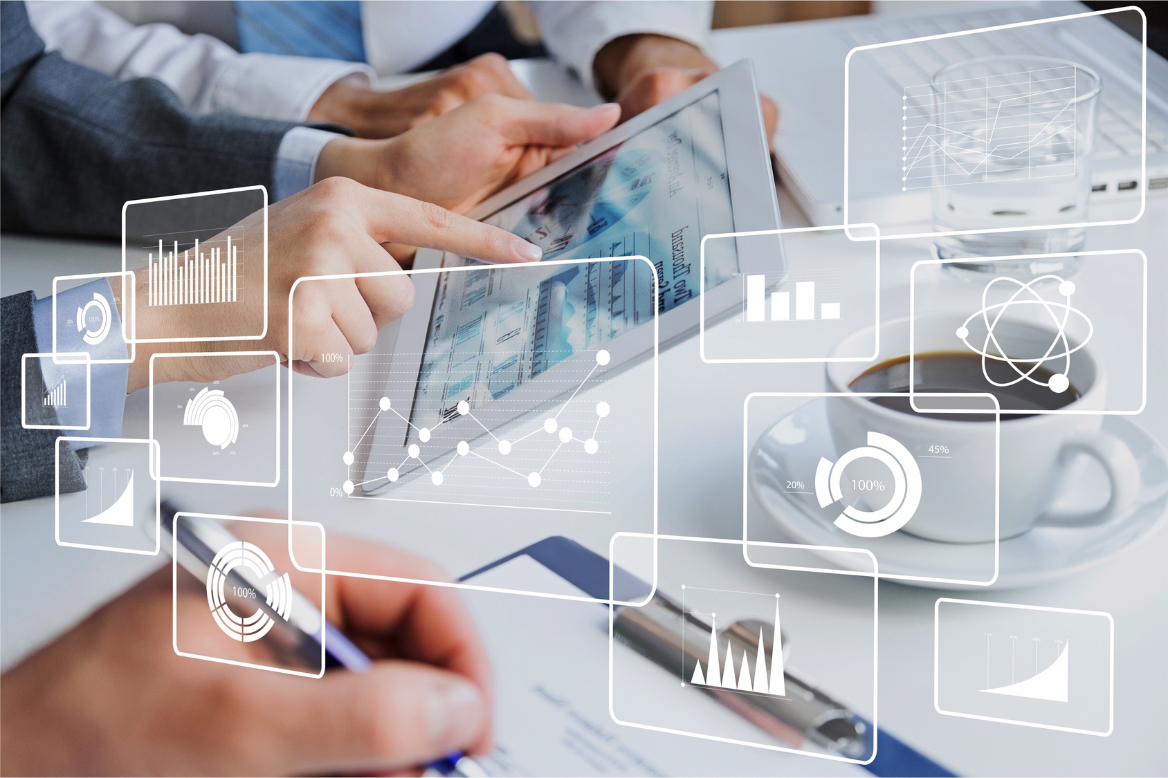 Two hands interact with a tablet displaying graphs and data visualizations. Around them, various statistical icons, including bar and line charts, indicate analyses and metrics. A cup of coffee and a pen are visible on the table, suggesting a business or research environment.