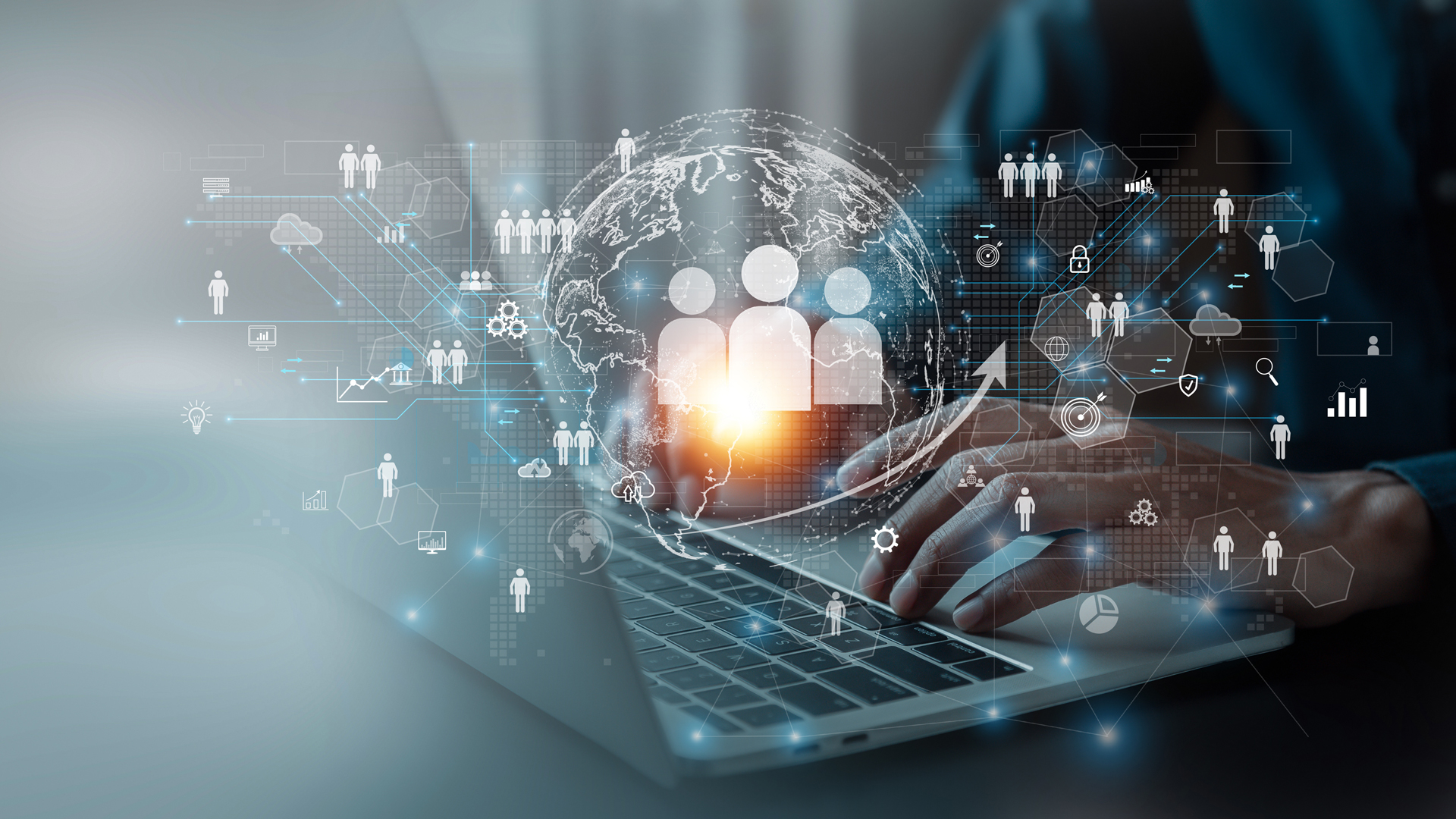 A person typing on a laptop, surrounded by digital graphics representing global connectivity, teamwork, and data analysis. Icons include people, graphs, and cloud symbols, symbolizing collaboration and technology in the modern workplace.