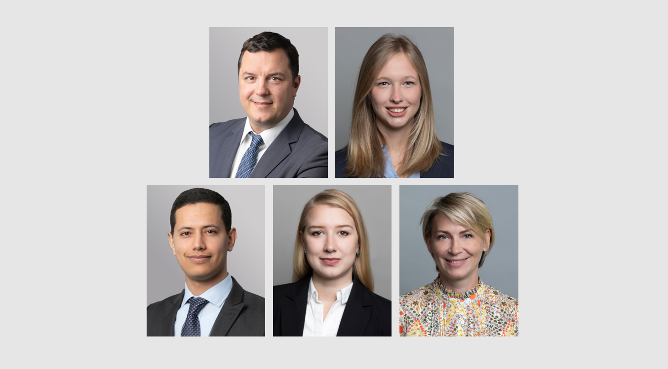 Five professional headshots are arranged in a grid format. The individuals display friendly expressions, wearing business attire. The top row features three people, while the bottom row shows two. The background is neutral, focusing on their faces and attire.